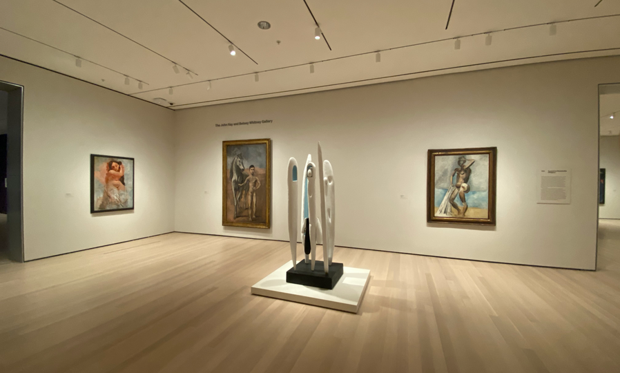 A sculpture by Louise Bourgeois in front of three paintings by Picasso, including his Boy Leading a Horse (second from left).