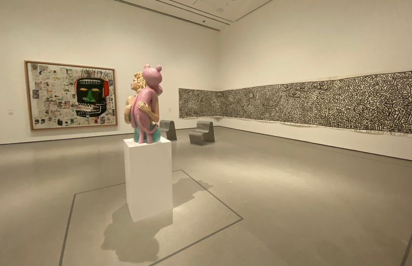 Pink Panther (1988) by Jeff Koons is flanked by Glenn (1985) by Jean-Michel Basquiat and Untitled, a 1982 Keith Haring. The chairs are by Scott Burton.