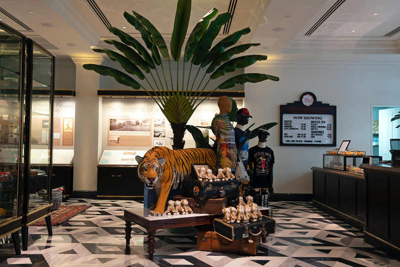 A stuffed tiger bares its teeth in one of the 30 outlets that make up the Raffles Arcade, for a spot of exclusive retail therapy.