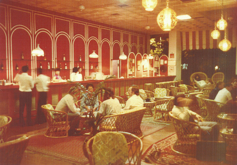The world-famous Long Bar, an institution within an institution, pictured here sometime in the early 1980s.