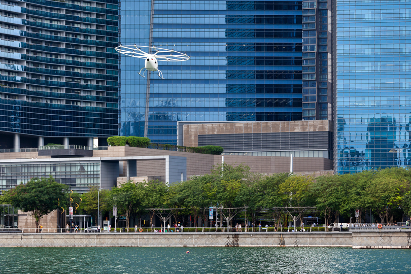 A Velocopter hovers over Singapore's Marina Bay.