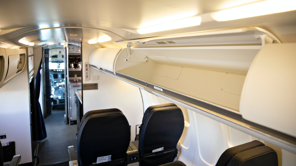 The aircraft has larger overhead bins to hold roller bags.