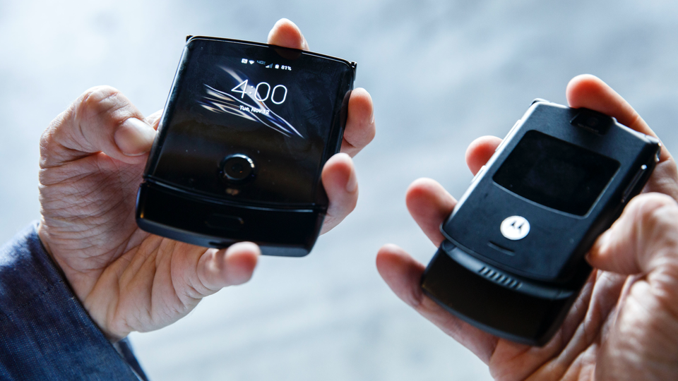 Like the original model (right), the new Razr shows a handy display even when it's closed.