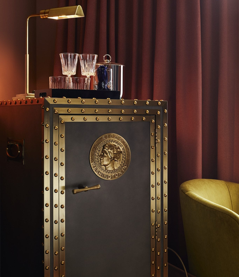 The mini-bar looks like an old-fashioned bank safe and, in a touch of irony, opens to reveal the actual room safe.