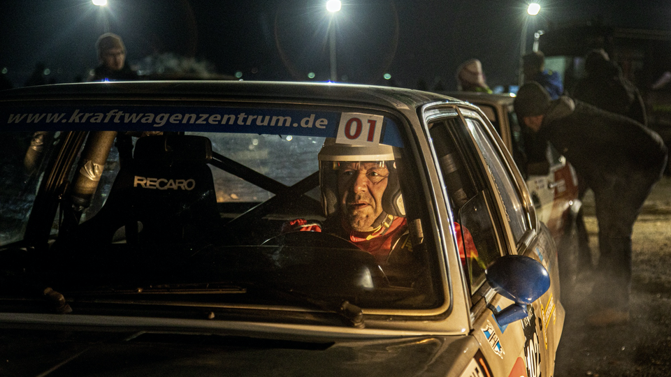 Driver Thomas Rippel pilots a classic BMW 320 to the start line for the Klassik run.