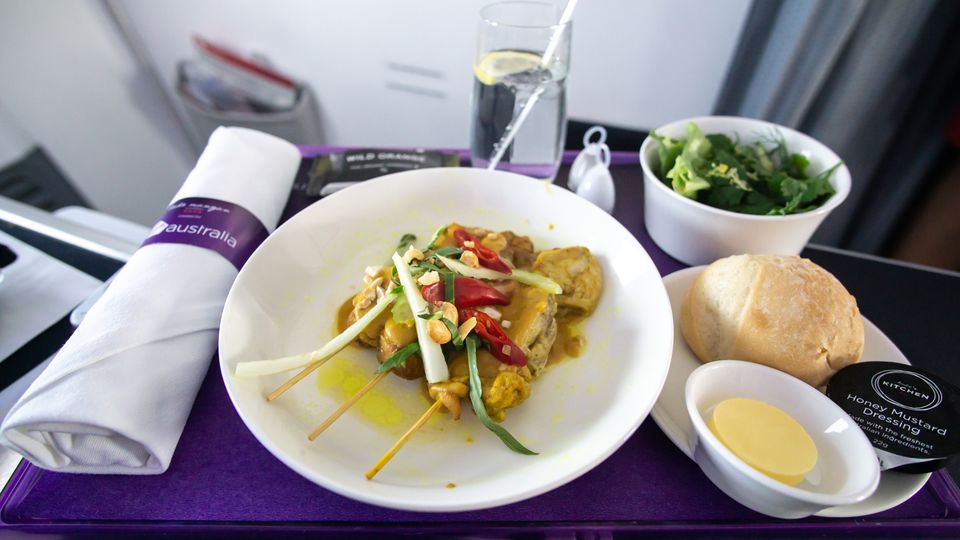 Chicken satay skewers served as a snack on a Melbourne-Launceston Boeing 737 flight.