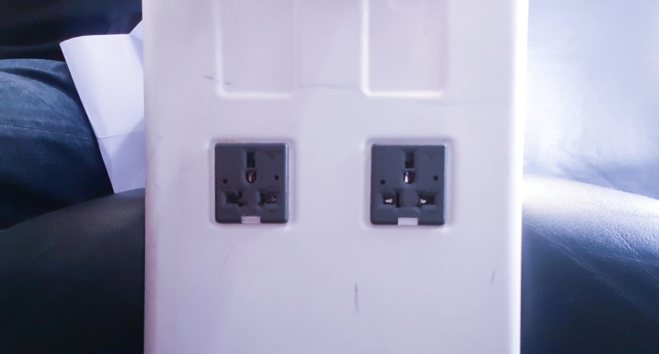 If available, an AC power socket will be on the centre console, near your legs.