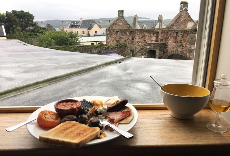 A full Scottish breakfast, with a side pour of Ardbeg, in Port Ellen.