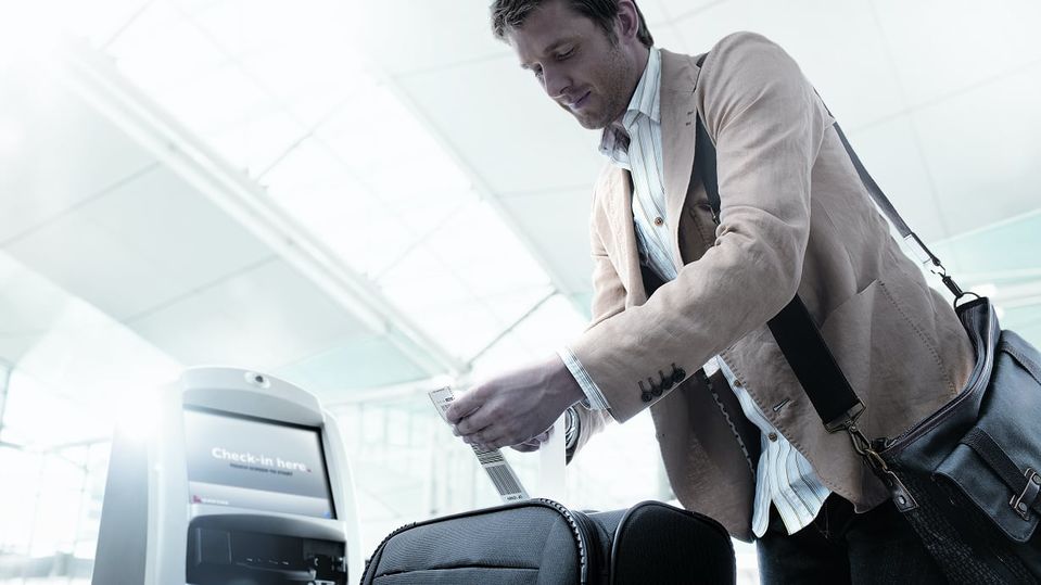 Check yourself in, then DIY bag drop – and don't forget the Q Bag Tag.