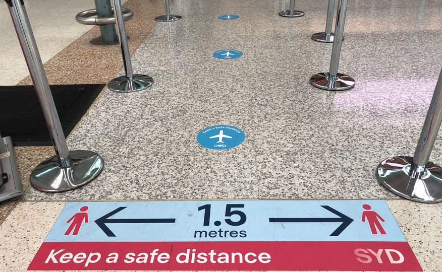Social distancing reminders at Sydney Airport Terminal 3.