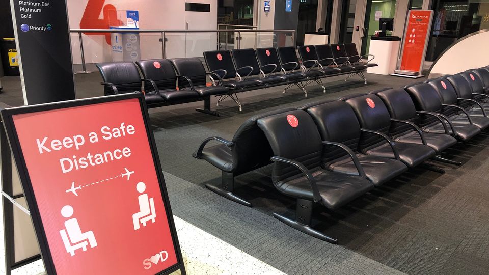 Social distancing reminders at Sydney Airport Terminal 3.