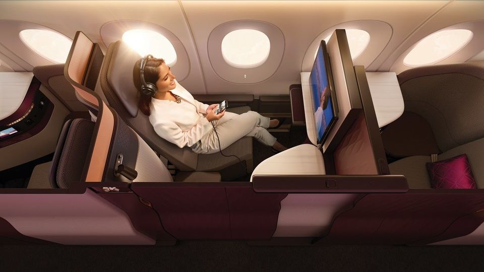 Direct aisle access and sliding doors are staples of Qsuite business class.