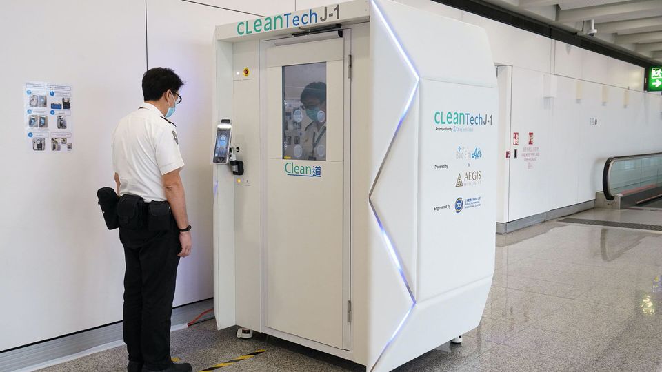 A full-body disinfecting booth at Hong Kong airport.