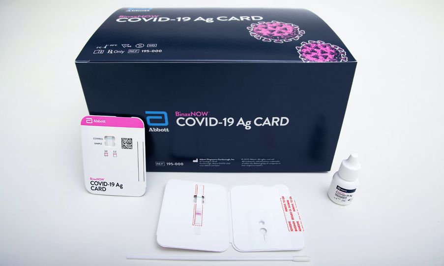 Abbott Laboratories' rapid COVID test kit uses a card the size of a boarding pass stub.