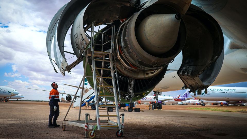 An employee tends to an engine.. David Gray/Bloomberg