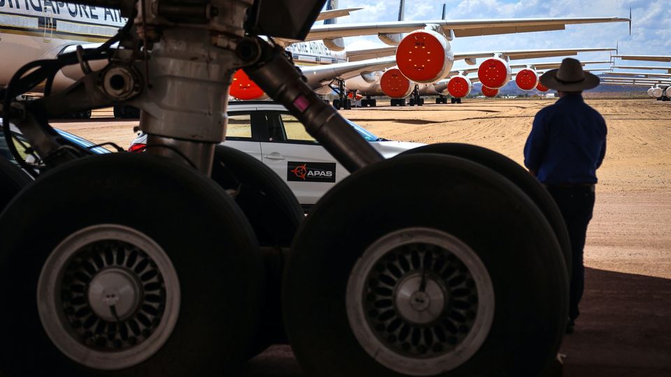 Tom Vincent checks over aircraft at the facility.. David Gray/Bloomberg