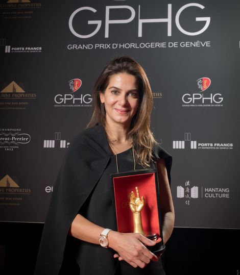 Piaget CEO Chabi Nouri cradles the Aigullie d'Or trophy.
