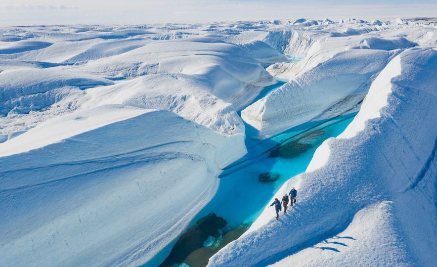 Traversing the Antarctic landscape with a guide on a White Desert trip.