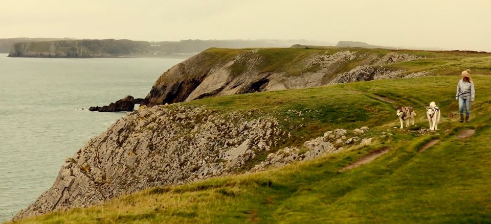 Walking along the 870-mile Wales Coast Path near Tenby in southern Pembrokeshire.