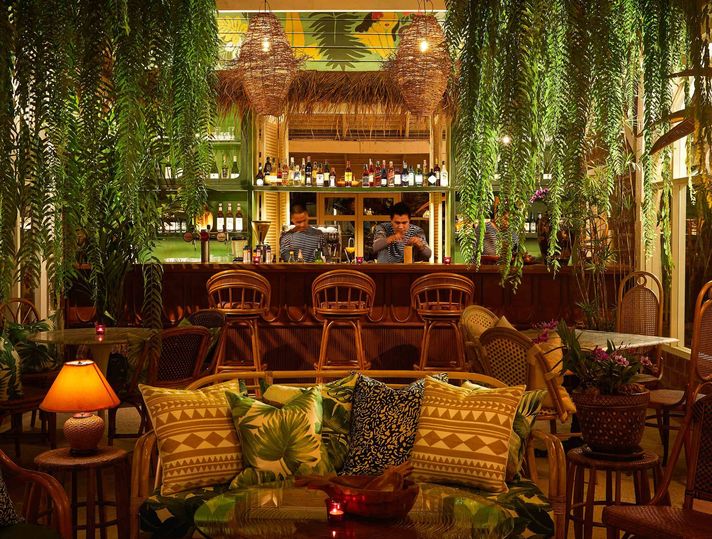 Bartenders make tiki drinks at Malo, the bar at the Peri Hotel Hua Hin.