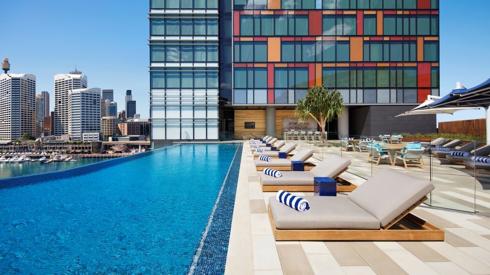 The rooftop pool overlooks Darling Harbour and the city