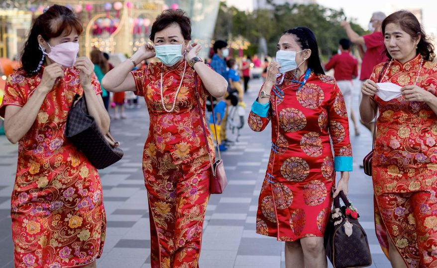 Face masks are still very much a necessity in Bangkok, even when dressing up to celebrate the Lunar New Year.
