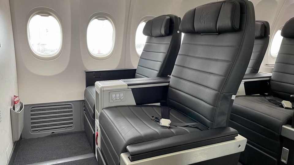The aisle armrest on these business class seats retracts for easier access.