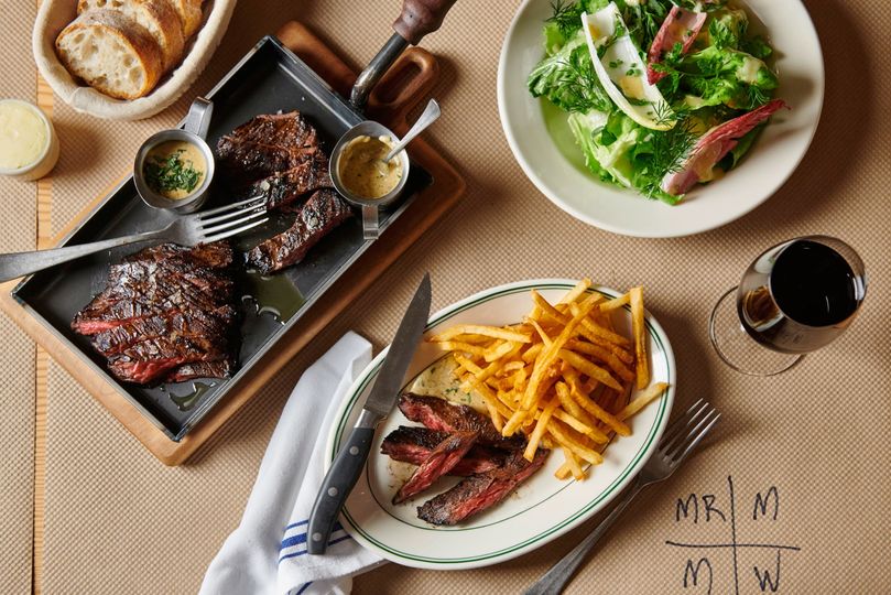 Skirt Steak NYC keeps it simple: steak, frites, and salad. Your waiter will keep track of your preferred meat doneness by writing on the paper tablecloth.