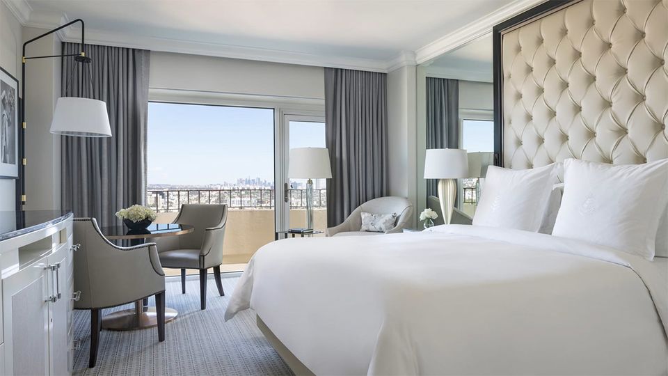 A Deluxe Balcony Room at the Four Seasons, with a view to the city beyond
