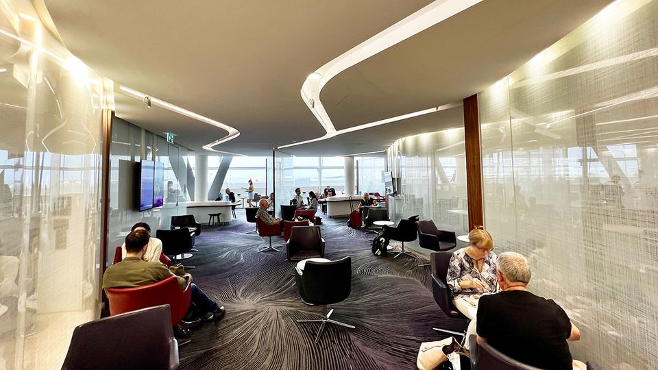 The lounge offers a mix of high and low seating, as well as desks with power outlets
