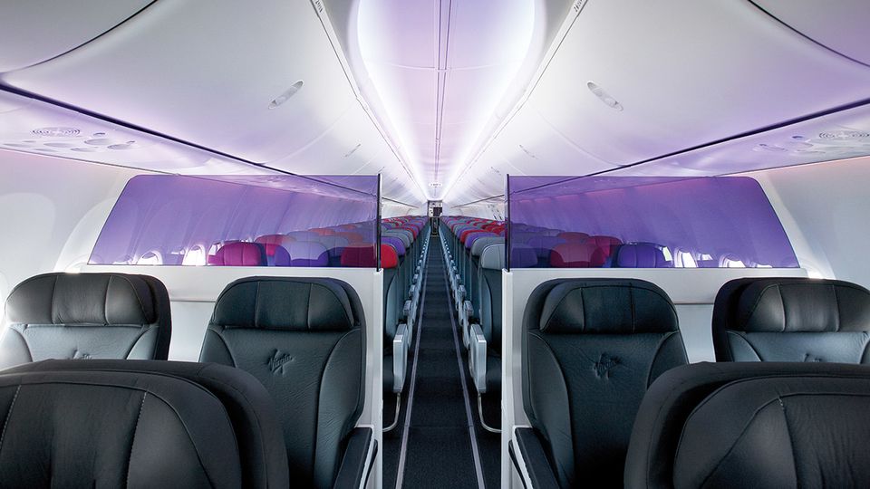 The business class cabin is divided from economy by an attractive screen