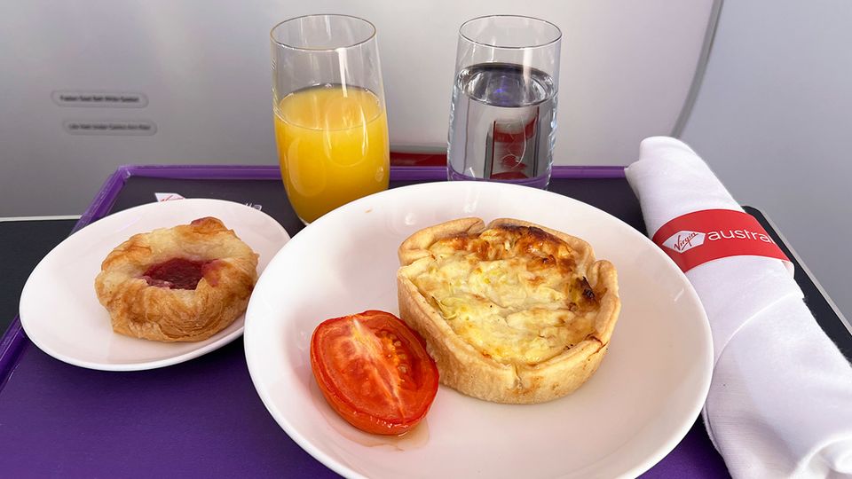 Leek quiche with a baked tomato, and Danish on the side