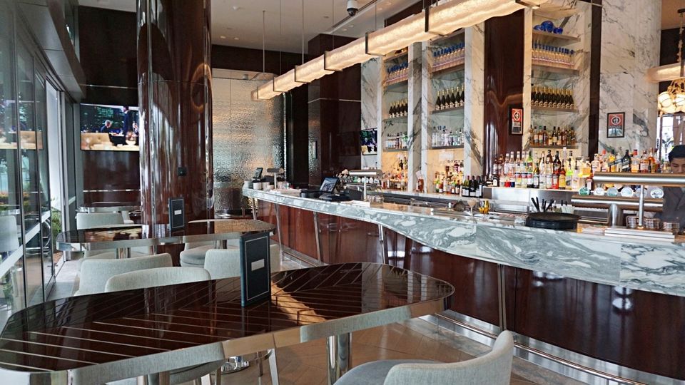 TWR Bar features indoor and covered outdoor seating with a harbour view.