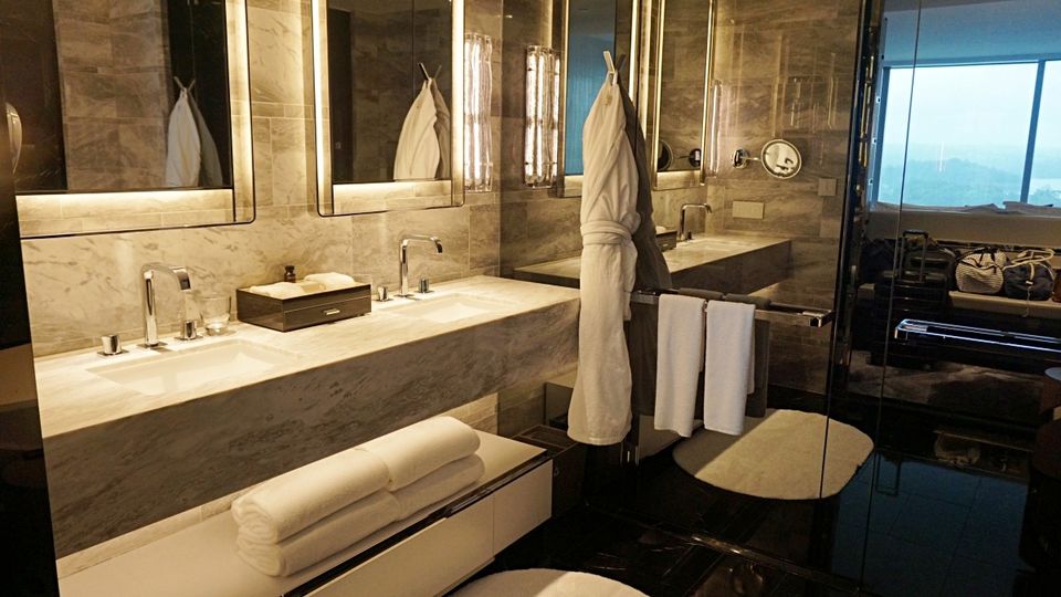 The bathroom features a large shower, standalone bath and a futuristic toilet.