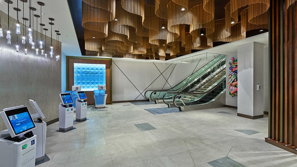 The lounge is entered via a downstairs lobby set underneath a wave-inspired installation.