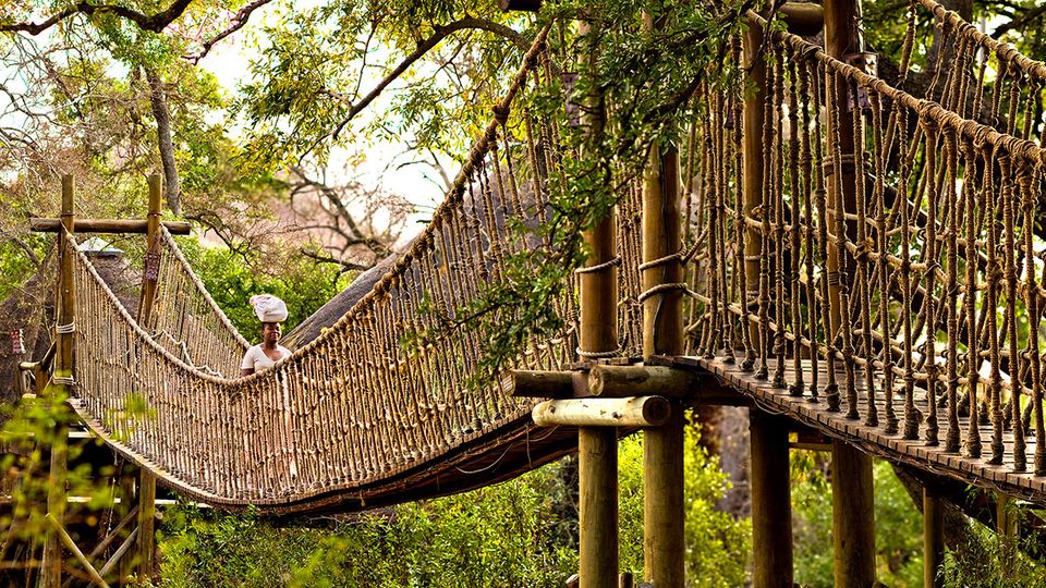Some of the rooms at the Safari Lodge are accessed by swing bridges.