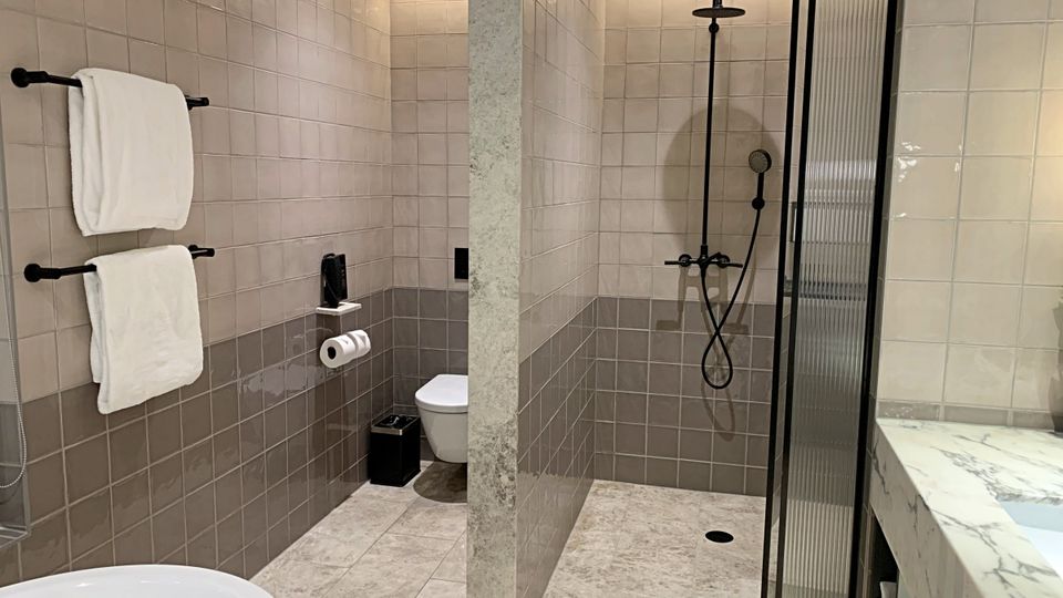 The bathroom features a double vanity, large bath and walk-in shower.