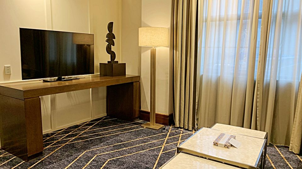 The living room features on-theme sculptures and artworks.