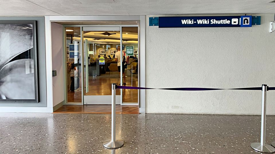 Follow the signs to the inter-terminal shuttle and you'll also find the Plumeria Lounge.