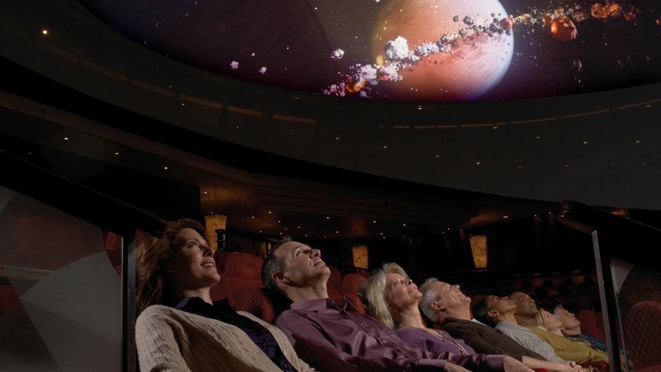 Travellers can enjoy educational films about astronomy while deeply reclined.