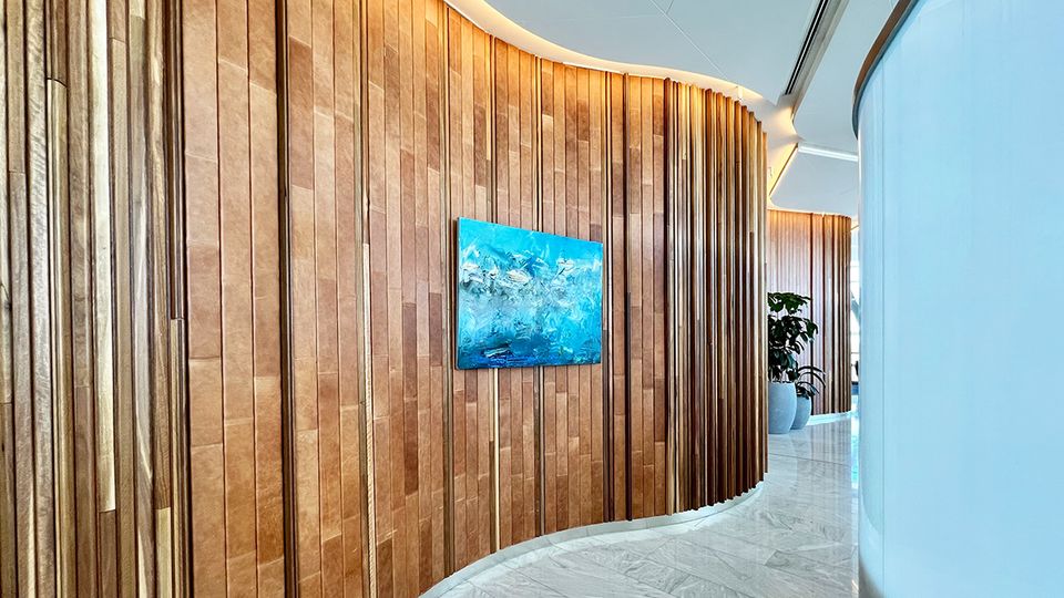 Oak and leather-clad walls give the space a warmer, more inviting feel.