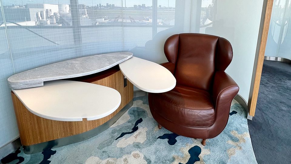 When it's time to work, winged tables can be slid out from the main bench space.