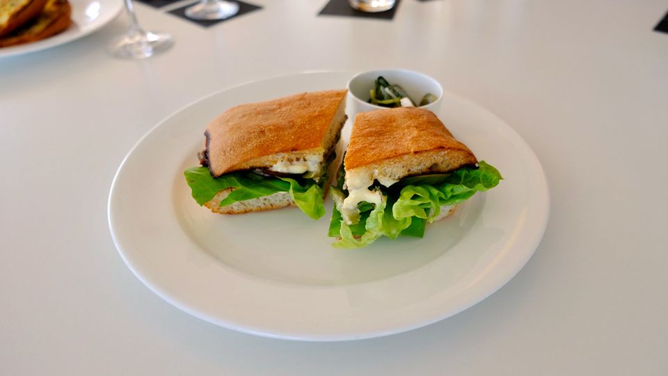 The grass-fed steak sandwich with caramelised onion and pickles.