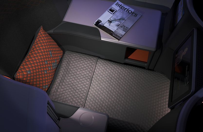 Singapore Airlines' Boeing 737 MAX business class seat transforms into a lie-flat bed.
