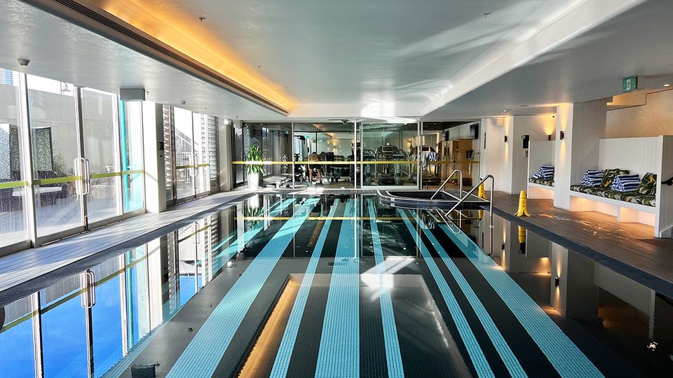 Hotel guests can access an indoor swimming pool and gym, with a small outdoor cabana area.