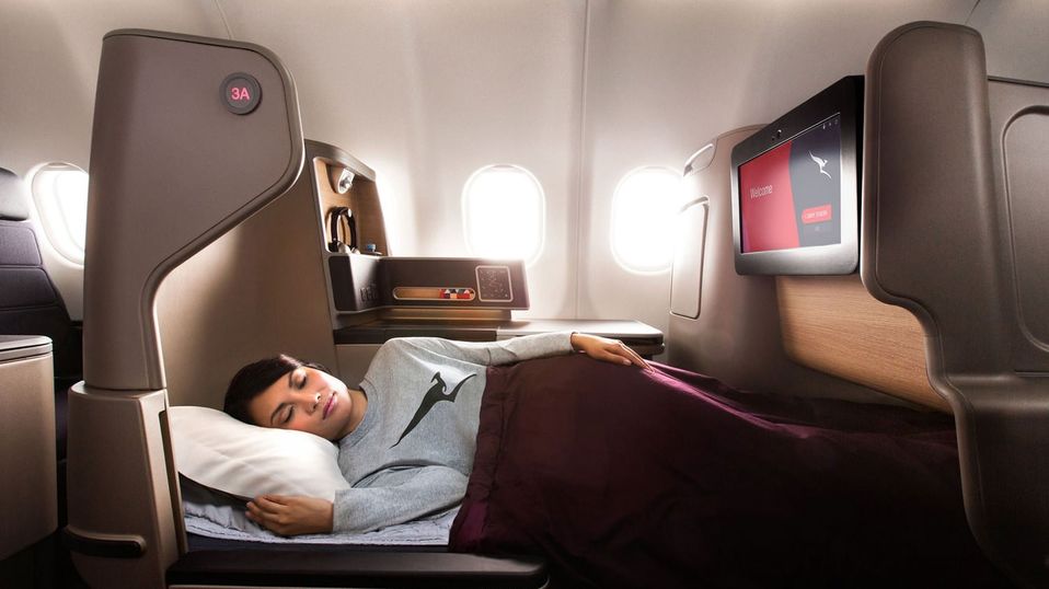 It's definitely worth bidding for business class on overseas flights: you'll enjoy the trip much more, and arrived refreshed.