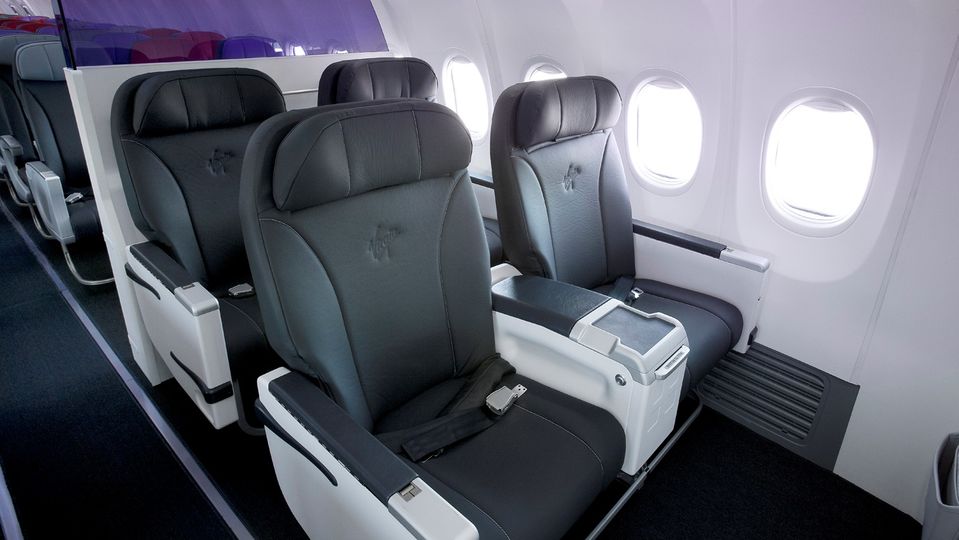 Four free upgrades to business class to use as you see fit...yes please!