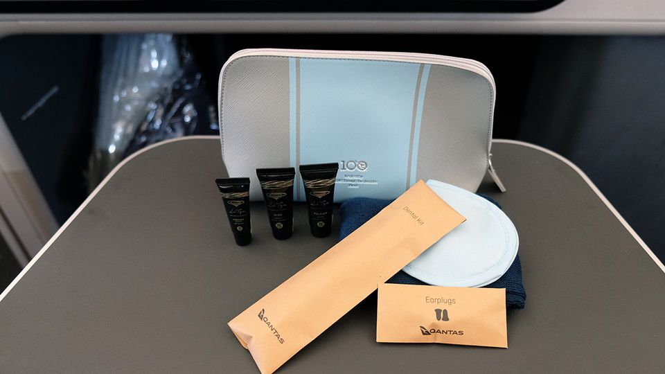 A vintage-inspired amenities kit embossed with the airline's centenary logo.