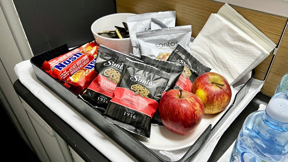 Fruit, nuts, pretzels and chocolate bars were also available self-serve by the galley.
