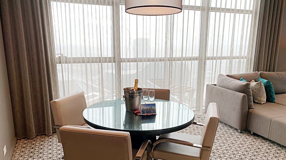 The room featured a large dining table adjacent to the living area.